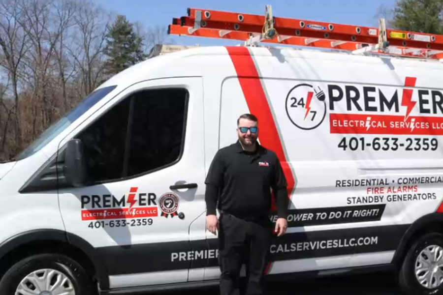 Premier Electrical Services employee and service van