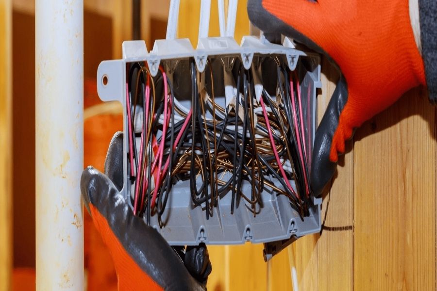 Electrician completing electrical repairs